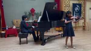 Violin student with CAM Faculty at the piano