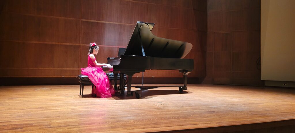 A Chopin Academy of Music piano student preparing for the stage of Benaroya Hall