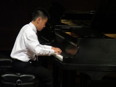 An Exam Track Program student performs his end of the year Honors Recital at Benaroya Hall
